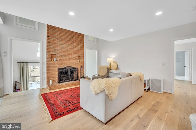 38528 Lime Kiln Rd, Middleburg, VA 20117 - living area with light wood-style flooring, recessed lighting, a brick fireplace, and baseboards