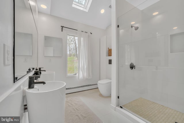 38528 Lime Kiln Rd, Middleburg, VA 20117 - bathroom with a baseboard heating unit, toilet, a walk in shower, lofted ceiling with skylight, and tile patterned flooring