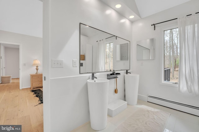 38528 Lime Kiln Rd, Middleburg, VA 20117 - bathroom featuring a baseboard radiator, lofted ceiling, wood finished floors, and a healthy amount of sunlight
