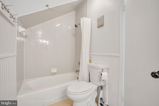38528 Lime Kiln Rd, Middleburg, VA 20117 - bathroom with toilet, shower / tub combo with curtain, and a wainscoted wall