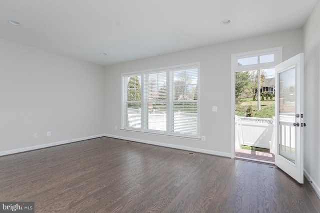 3393 Monterey Dr, Rockingham, VA 22801 - unfurnished living room with baseboards, plenty of natural light, and dark wood finished floors