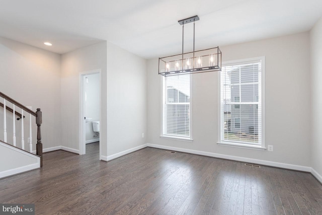 3393 Monterey Dr, Rockingham, VA 22801 - unfurnished dining area with dark wood finished floors, recessed lighting, a chandelier, stairs, and baseboards
