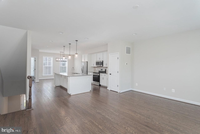 3393 Monterey Dr, Rockingham, VA 22801 - kitchen with white cabinets, baseboards, visible vents, and stainless steel appliances