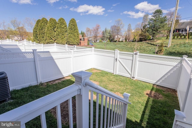 3393 Monterey Dr, Rockingham, VA 22801 - view of yard featuring central AC unit, a fenced backyard, and a gate