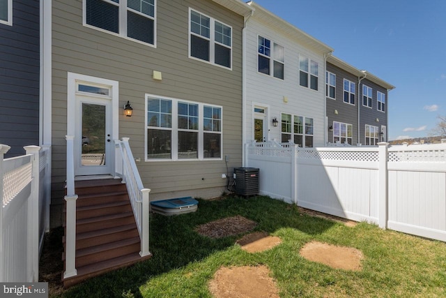 3393 Monterey Dr, Rockingham, VA 22801 - back of property with central AC unit, fence, and a lawn