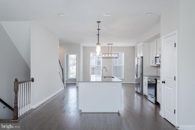 3393 Monterey Dr, Rockingham, VA 22801 - kitchen featuring dark wood-type flooring, white cabinetry, a kitchen island with sink, a sink, and stainless steel appliances