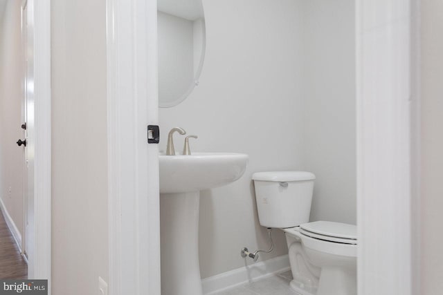 3393 Monterey Dr, Rockingham, VA 22801 - half bathroom with a sink, tile patterned floors, toilet, and baseboards