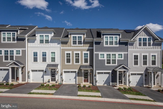 3393 Monterey Dr, Rockingham, VA 22801 - townhome / multi-family property with board and batten siding, driveway, and a garage