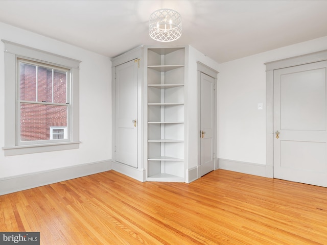 803 Berryville Ave, Winchester, VA 22601 - unfurnished bedroom featuring baseboards and light wood finished floors