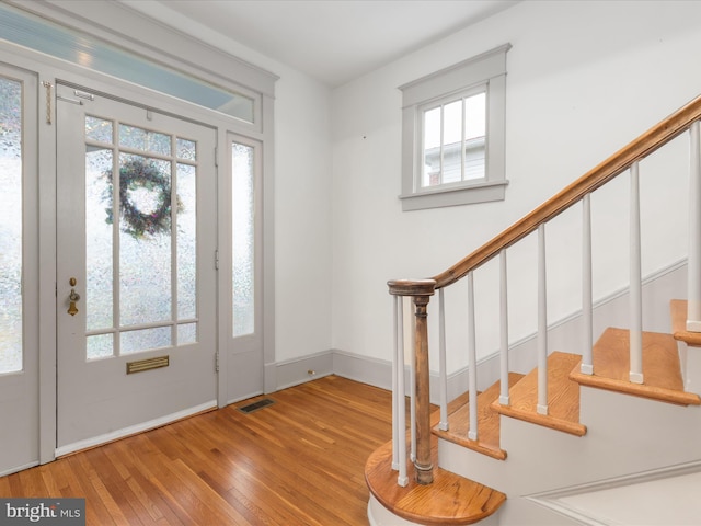 803 Berryville Ave, Winchester, VA 22601 - foyer entrance featuring wood-type flooring, stairway, and a healthy amount of sunlight