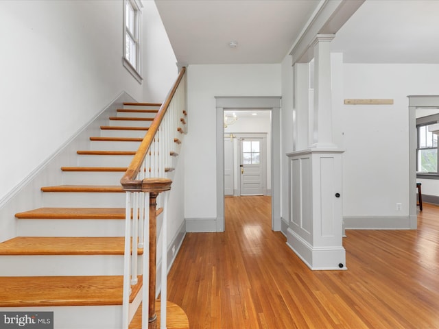 803 Berryville Ave, Winchester, VA 22601 - staircase featuring wood finished floors, baseboards, and a healthy amount of sunlight