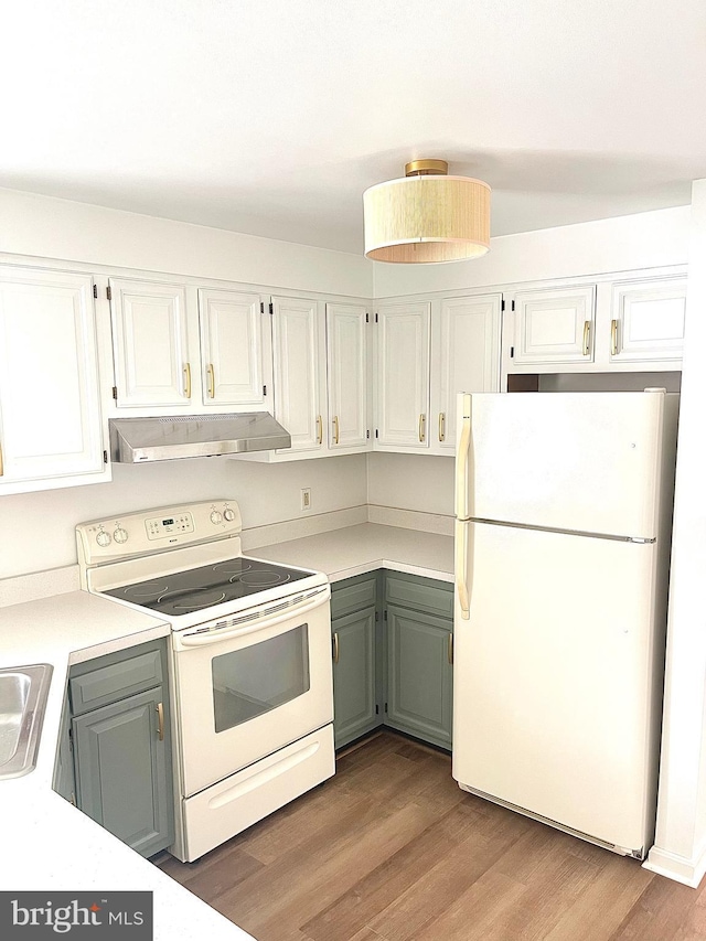 kitchen featuring white cabinets, light wood-type flooring, white appliances, and under cabinet range hood