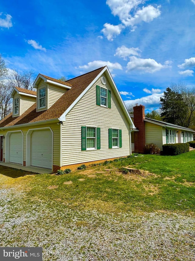 view of property exterior with a lawn and roof with shingles