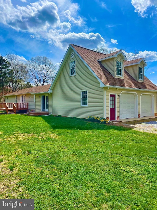 view of front of property with a garage, roof with shingles, a front yard, driveway, and a deck
