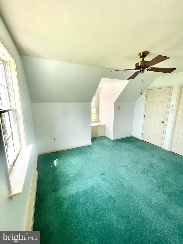 bonus room featuring carpet, baseboards, lofted ceiling, and ceiling fan