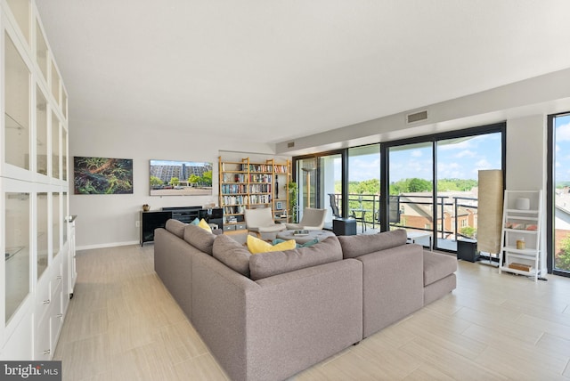 1530 Key Blvd Unit 528, Arlington, VA 22209 - living area featuring healthy amount of natural light and baseboards