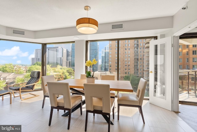 1530 Key Blvd Unit 528, Arlington, VA 22209 - dining room featuring plenty of natural light and a view of city