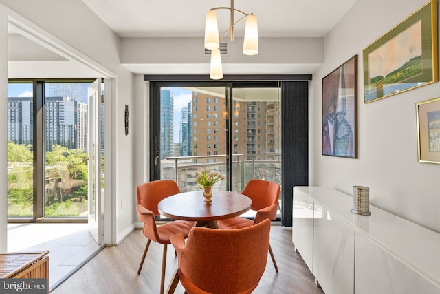 1530 Key Blvd Unit 528, Arlington, VA 22209 - dining area featuring a view of city and wood finished floors