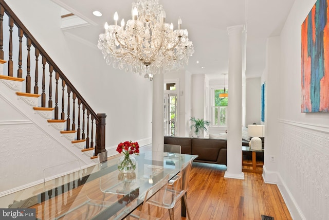 entryway with recessed lighting, hardwood / wood-style floors, baseboards, stairway, and a notable chandelier