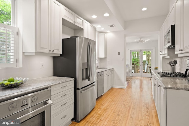 kitchen featuring recessed lighting, appliances with stainless steel finishes, ceiling fan, white cabinetry, and visible vents