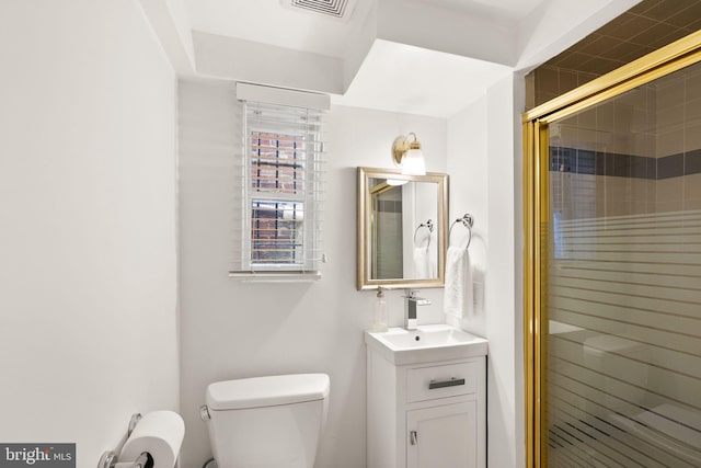 full bathroom featuring visible vents, a shower stall, toilet, and vanity