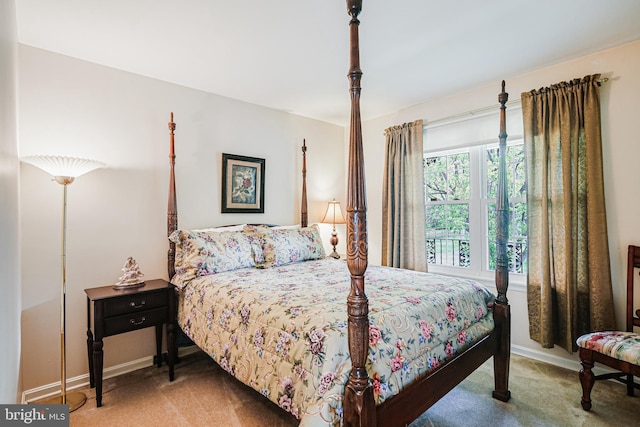 bedroom with carpet floors and baseboards