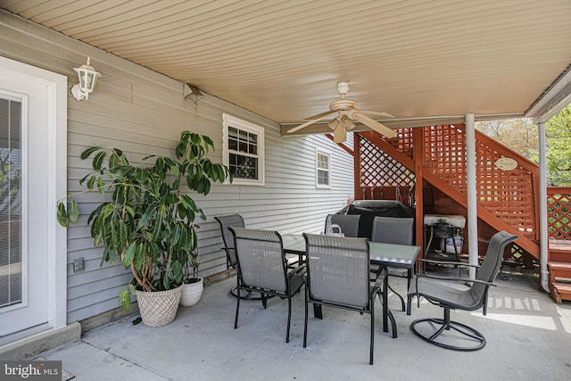 view of patio featuring a ceiling fan and outdoor dining area