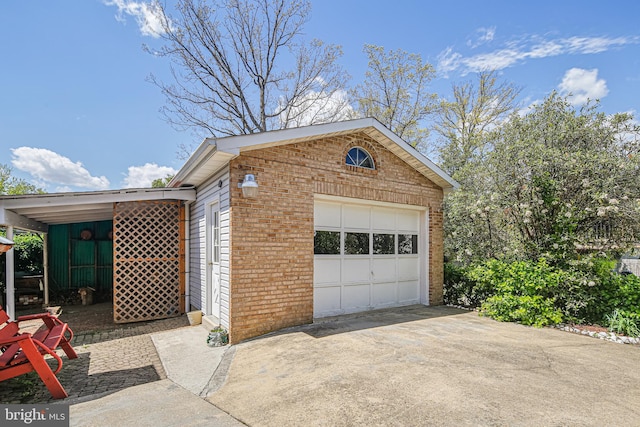 garage with concrete driveway