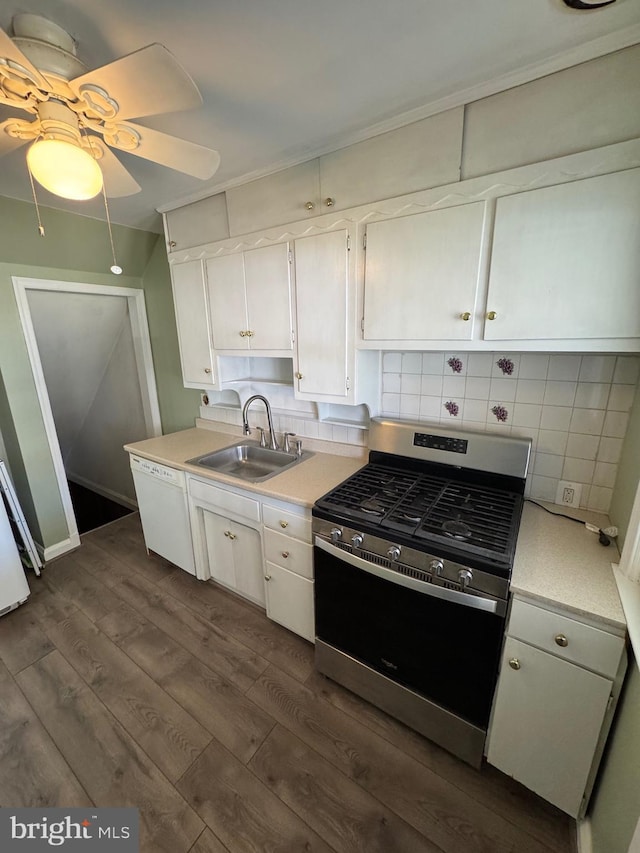 kitchen featuring white dishwasher, stainless steel gas stove, light countertops, and a sink