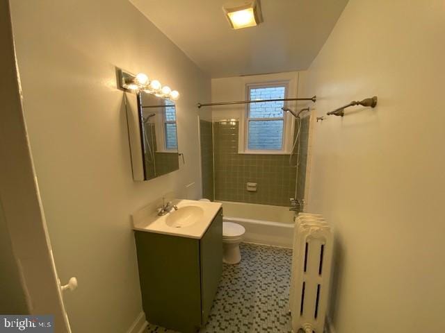 1674 Irving St NW, Washington, DC 20010 - bathroom with radiator, vanity, toilet, and  shower combination