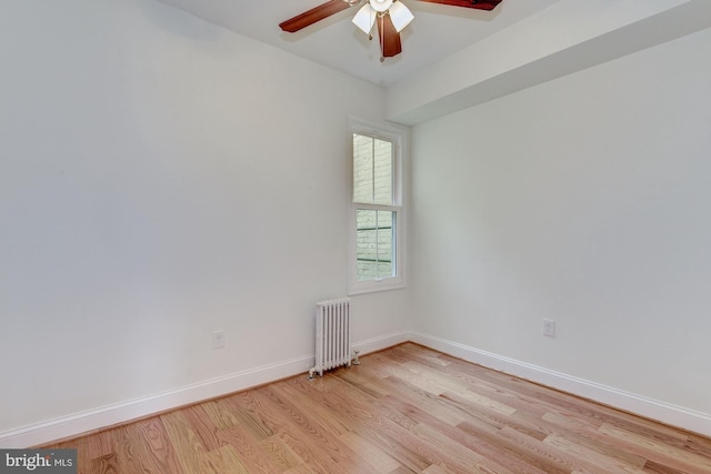 1674 Irving St NW, Washington, DC 20010 - spare room with baseboards, a ceiling fan, light wood-style flooring, and radiator heating unit