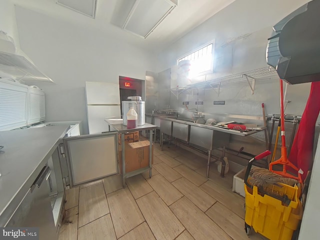 kitchen featuring freestanding refrigerator and wood finish floors