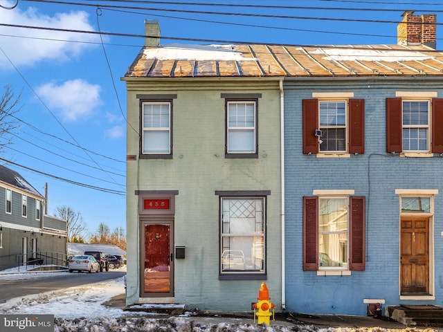 435S Market St, Frederick, MD 21701 - view of front of house with a chimney, a standing seam roof, metal roof, and brick siding