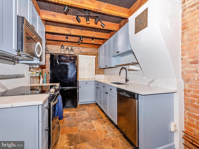435S Market St, Frederick, MD 21701 - kitchen with a sink, beamed ceiling, brick wall, and stainless steel appliances