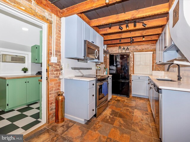 435S Market St, Frederick, MD 21701 - kitchen with beamed ceiling, a wall mounted AC, a sink, stainless steel appliances, and brick wall