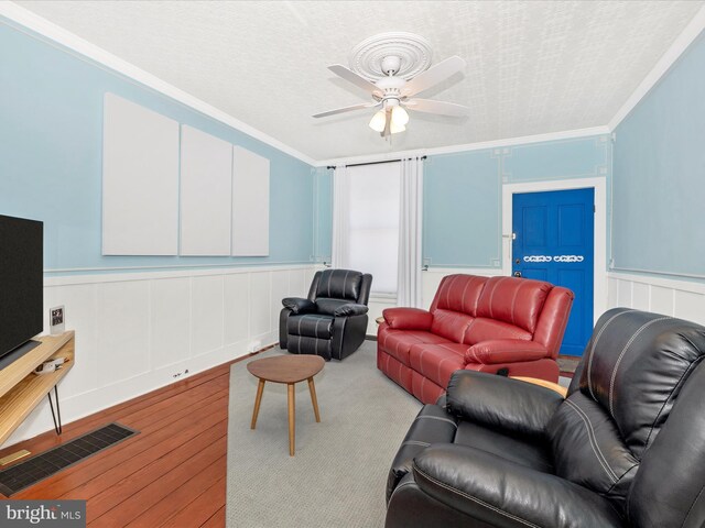 435S Market St, Frederick, MD 21701 - living room featuring visible vents, a ceiling fan, a textured ceiling, crown molding, and wood finished floors