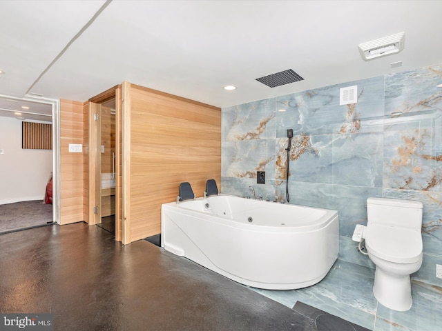 435S Market St, Frederick, MD 21701 - bathroom with toilet, concrete floors, a tub with jets, and recessed lighting
