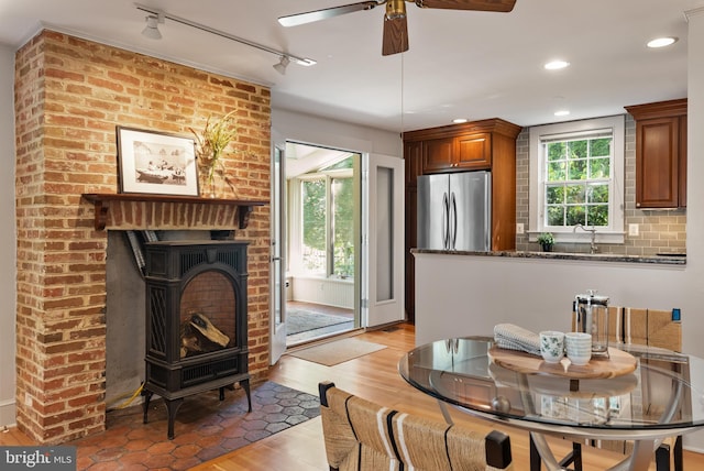 138 Charles St, Annapolis, MD 21401 - dining room featuring light wood-style flooring, a ceiling fan, rail lighting, and recessed lighting