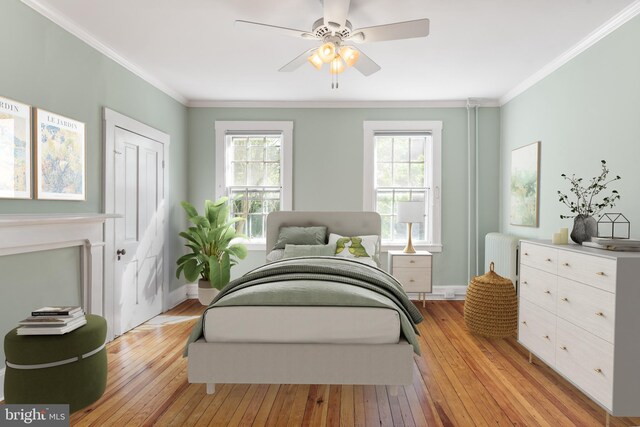 138 Charles St, Annapolis, MD 21401 - bedroom with light wood-type flooring, multiple windows, crown molding, baseboards, and ceiling fan