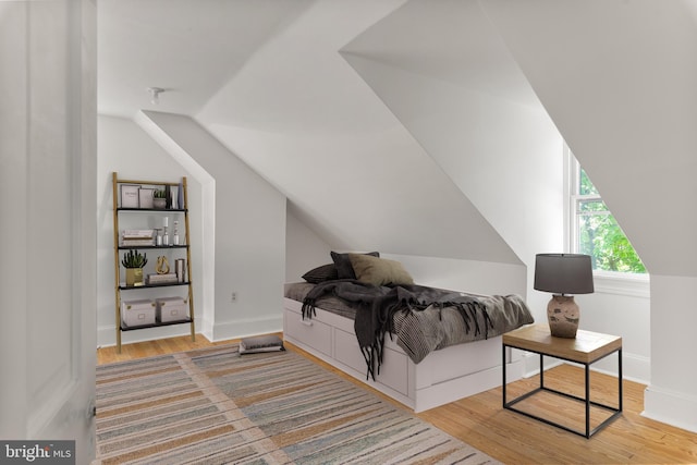 138 Charles St, Annapolis, MD 21401 - bedroom with lofted ceiling, wood finished floors, and baseboards