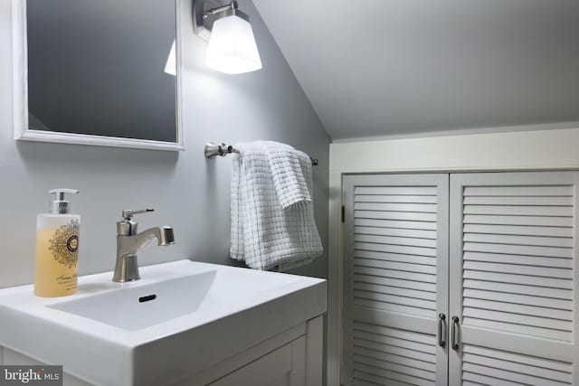 138 Charles St, Annapolis, MD 21401 - bathroom featuring vaulted ceiling and a sink
