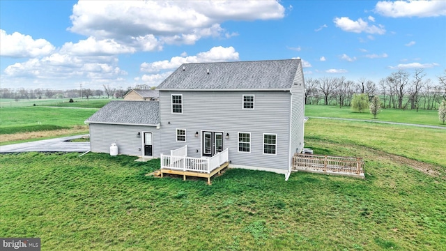 6301 Buchanan Trl W, Mercersburg, PA 17236 - back of property with roof with shingles, a deck, and a lawn