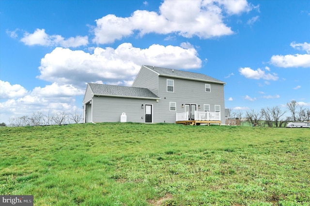 6301 Buchanan Trl W, Mercersburg, PA 17236 - rear view of property featuring a shingled roof, a wooden deck, and a lawn