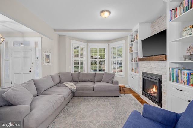 510 Quincy St NW, Washington, DC 20011 - living room featuring wood finished floors, a fireplace, and built in features