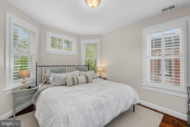 510 Quincy St NW, Washington, DC 20011 - bedroom featuring dark wood-style flooring, visible vents, and baseboards