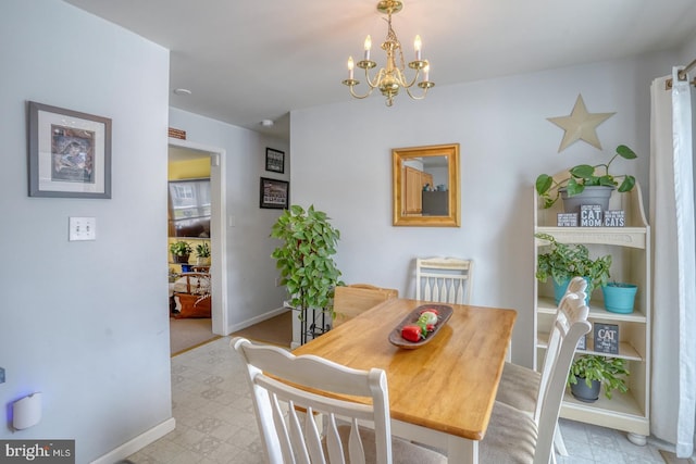 103 N Spinnaker Ln, Milton, DE 19966 - dining space featuring baseboards, a chandelier, and light floors