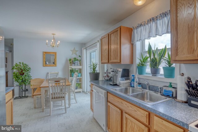 103 N Spinnaker Ln, Milton, DE 19966 - kitchen with dishwasher, a sink, a chandelier, hanging light fixtures, and light flooring