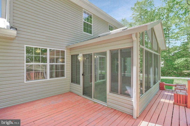 wooden deck featuring a sunroom