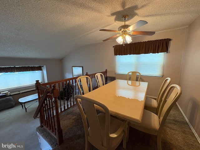 dining area with carpet floors, ceiling fan, baseboards, and a textured ceiling