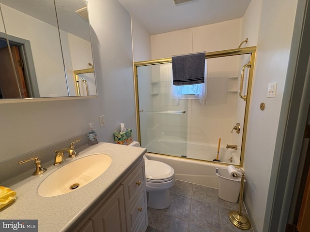 bathroom with shower / bath combination with glass door, vanity, tile patterned floors, toilet, and visible vents